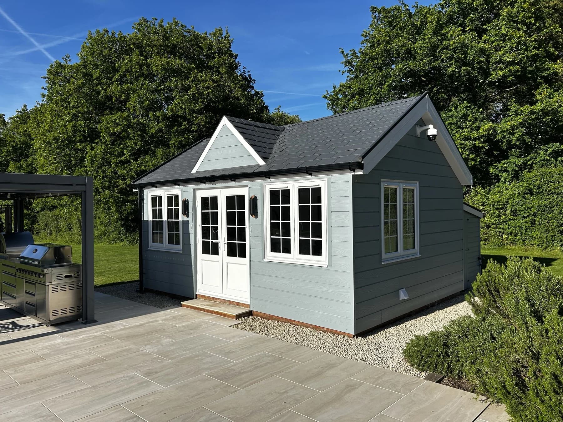 Completed garden room with composite slate roof and fibre-cement cladding, Maplehurst, West Sussex